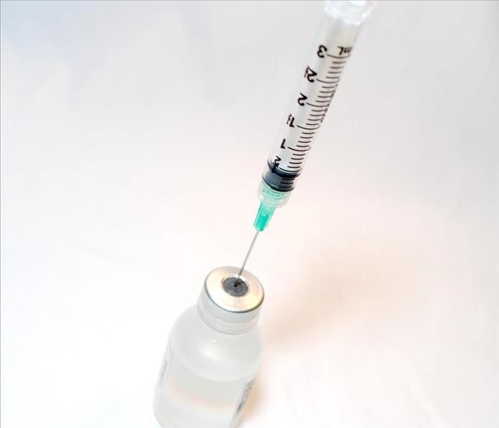 Needle containing a vaccine
